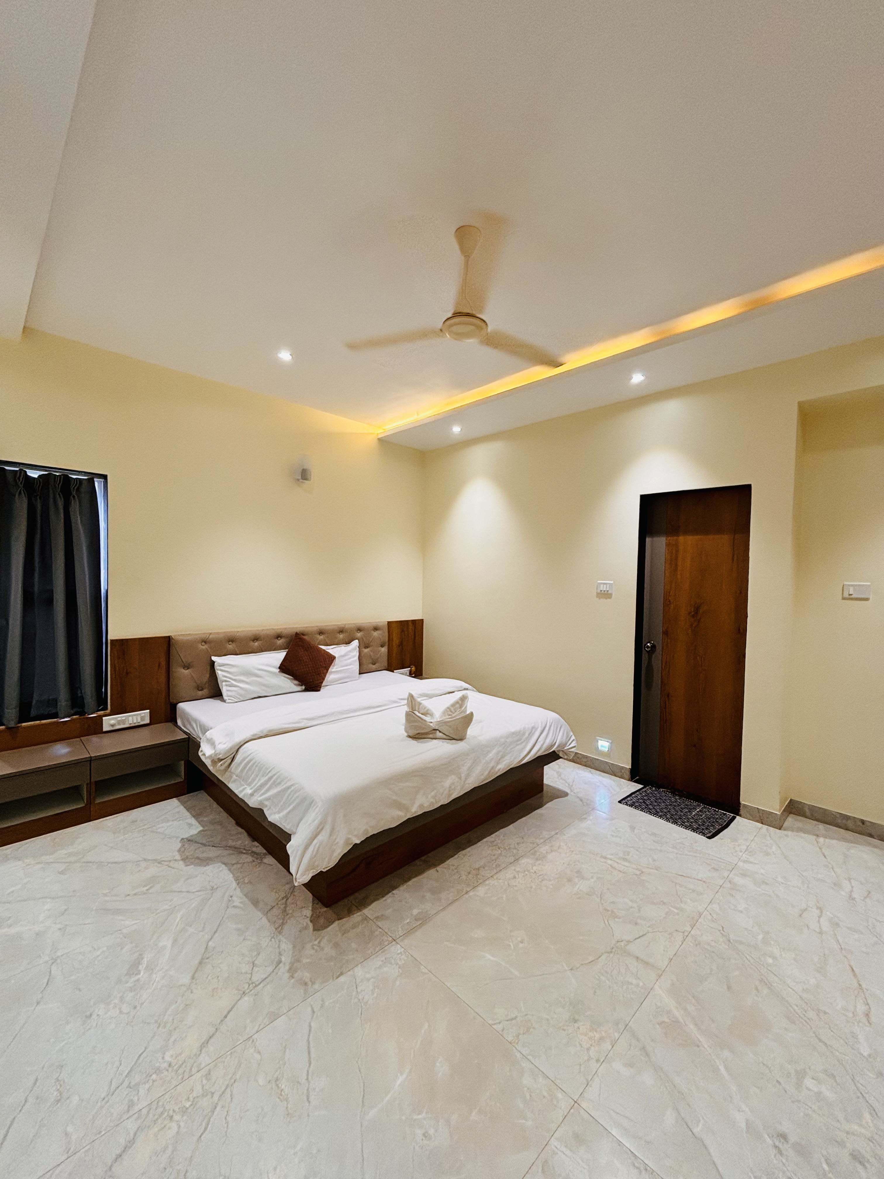 Elegantly lit bedroom at Panchgani holiday home