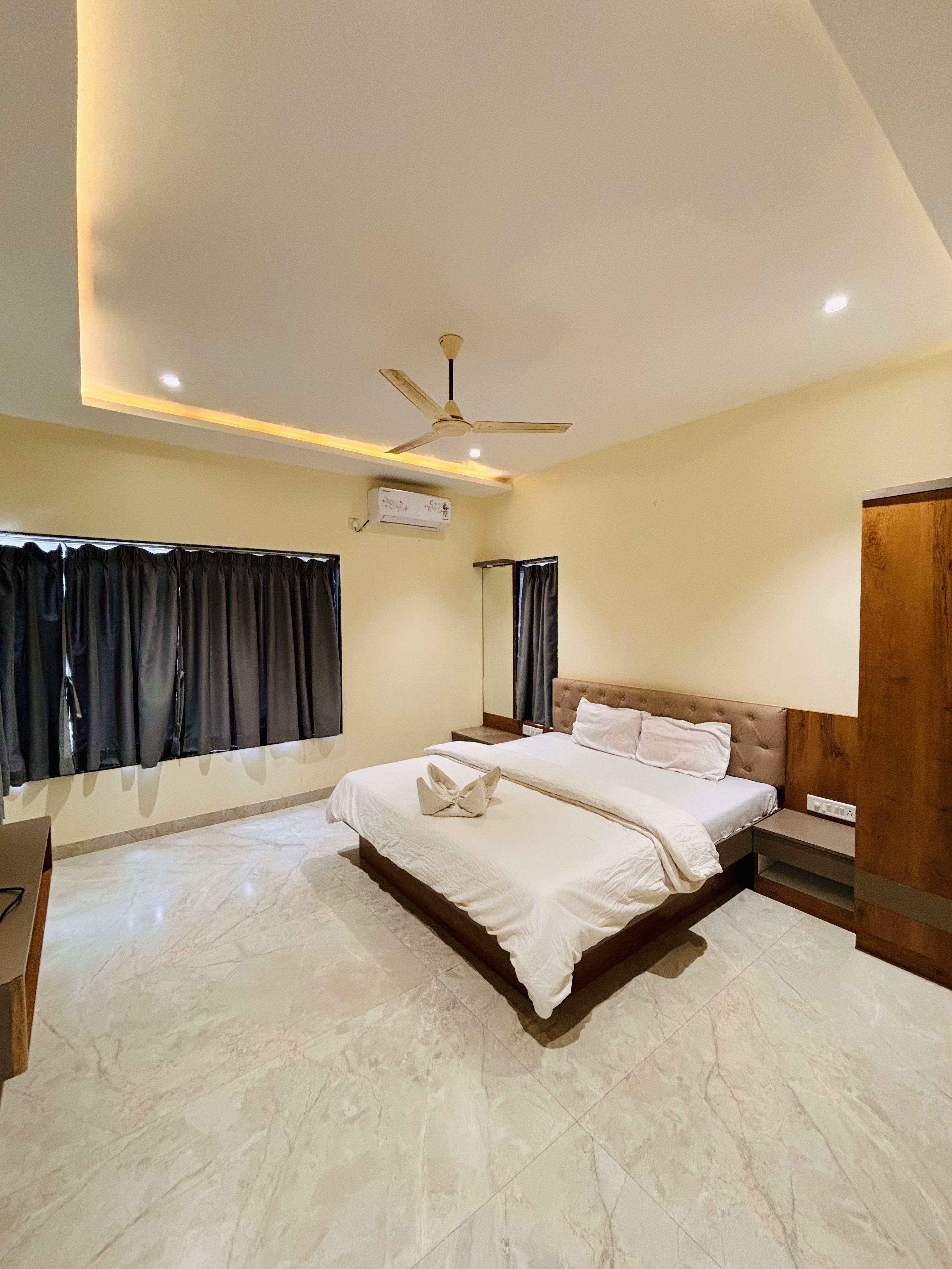 Premium master bedroom with AC at Paramount's Vinayaka Homestay