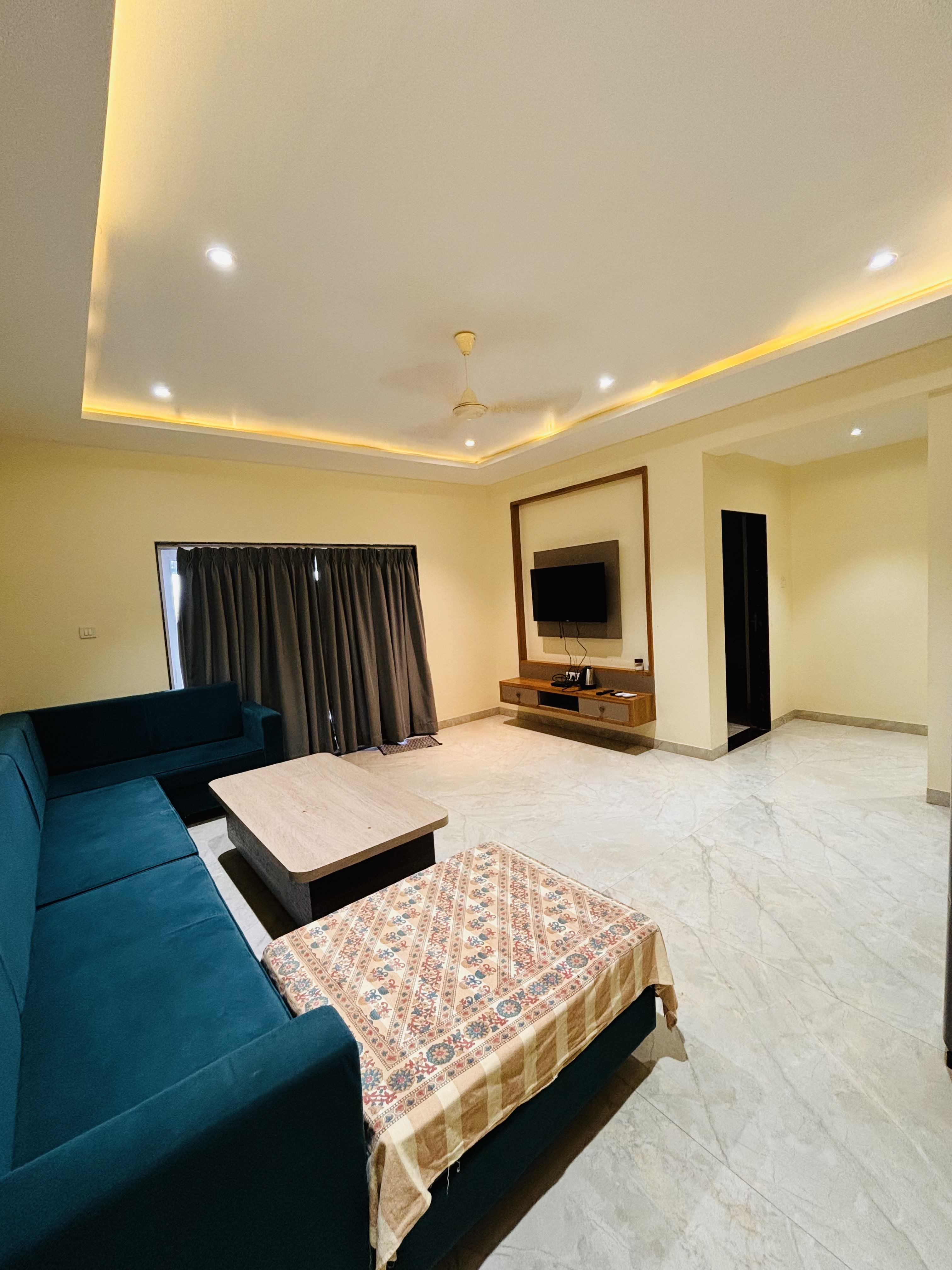 Spacious living room with Smart TV at Panchgani villa